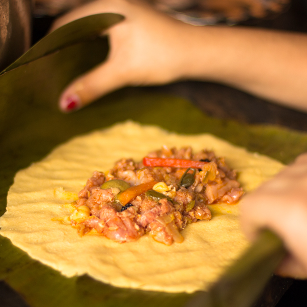 Tradicional
                            Venezuelan food called hallaca in elaboration
                            process by Nelson Espinoza_Shutterstock.com