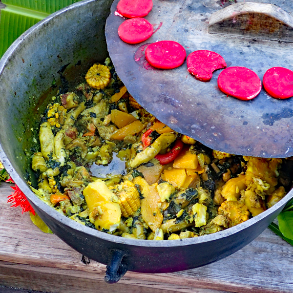 rustic iron pot
                            full of bright yellow Caribbean curry stew by Re
                            Metau_Shutterstock.com