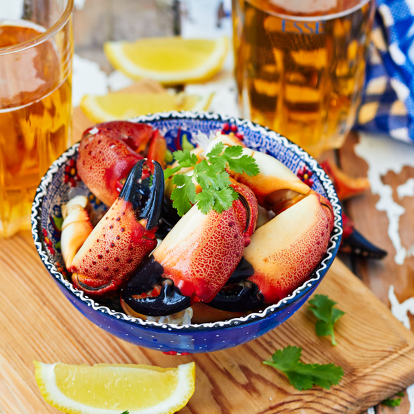 Boiled crab claws
                            and beer By comeirrez_Shutterstock.com
