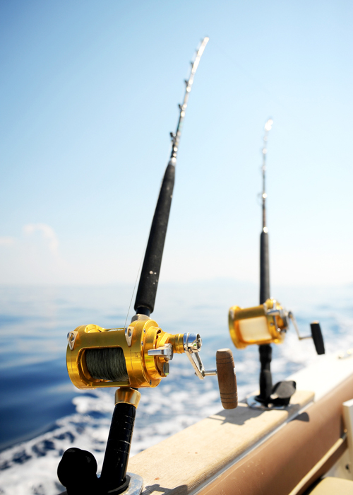 Ocean Fishing Reel on boat by
                                        cemay_iStock.com