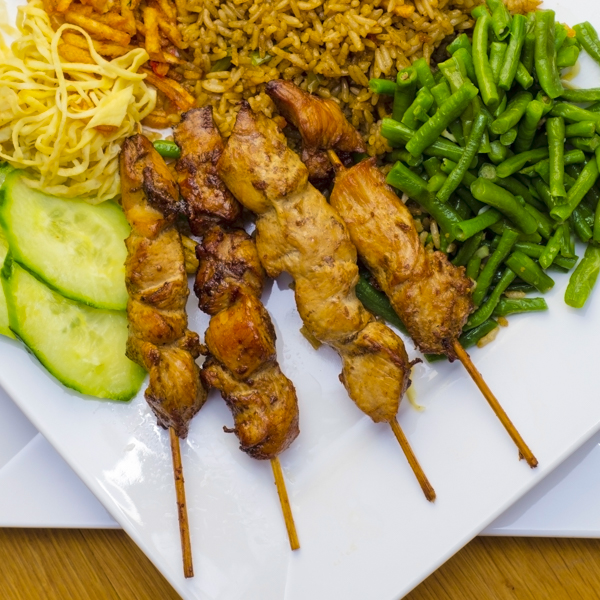 Traditional
                            suriname food, chicken sate with fried
                            rice_Pangfolio.com_shutterstock.com